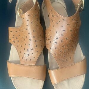 Woman’s leather sandals size 7. Side Velcro and back zipper closure. Worn once.